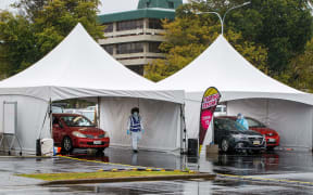 Motorists queue at the Otara testing station after a positive COVID-19 coronavirus case was reported in the community as the city enters a level 3 lockdown in Auckland on February 15, 2021.