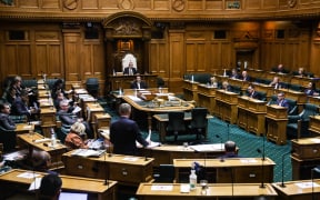 Minister for Covid-19 Response Chris Hipkins addresses a spaced out House sitting under Covid alert level 2