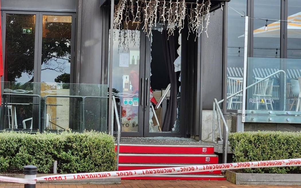A broken door at the scene of a robbery at Tokyo Bay restaurant, North Shore, Auckland.