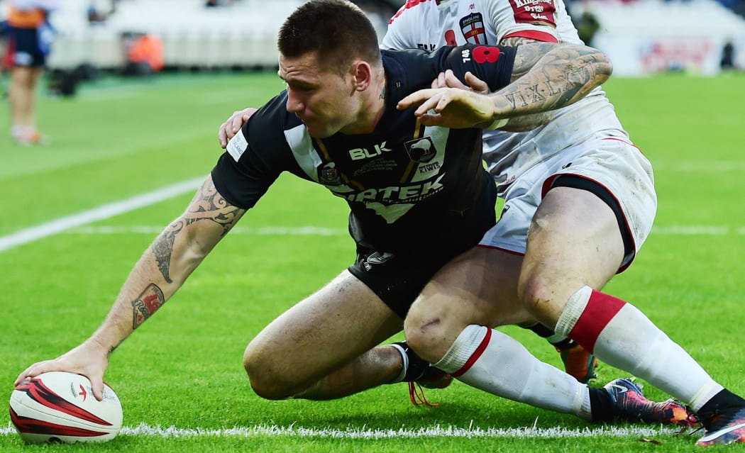 The Kiwis' wing Shaun Kenny-Dowall scores the game's only try.