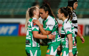 Layla Sae (centre) celebrates her try with Manawatu team-mates.