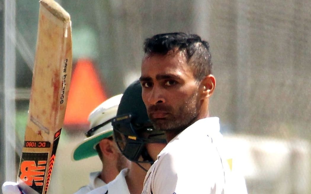 Auckland's Jeet Raval celebrates is 13th first-class century. March 2016.