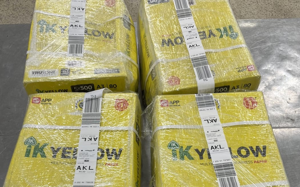 The yellow boxes declared as "paper ream" and marked as "IK Yellow".