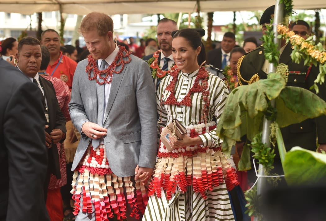 Britain's Prince Harry and his wife Meghan, the Duchess of Sussex visit a craft fair in Nuku'alo in Tonga.