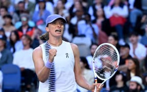 Iga Swiatek of Poland celebrates match point during the Women’s 2nd round match against Marie Bouzkova of Czechia on day 5 of the 2026 Australian Open tennis tournament at Melbourne Park in Melbourne, Wednesday, January 22, 2026. . (AAP Image/James Ross/Photosport)