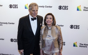 (FILES) In this file photo taken on December 05, 2021, US Speaker of the House of Representatives Nancy Pelosi (R) and husband Paul Pelosi attend the 44th Kennedy Center Honors at the Kennedy Center in Washington, DC. - An intruder attacked Paul Pelosi after breaking into his home in San Francisco on early on October 28, 2022, the office of Spaker Pelosi said, leaving him needing hospital treatment.  \