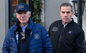 A November 29, 2024 photo shows US President Joe Biden and son Hunter Biden stepping out of a bookstore while shopping in Nantucket, Massachusetts on November 29, 2024. - Biden on Sunday issued an official pardon for his son Hunter, who is facing sentencing for two criminal cases related to tax evasion and the purchase of a firearm. (Photo by Mandel NGAN / AFP)
