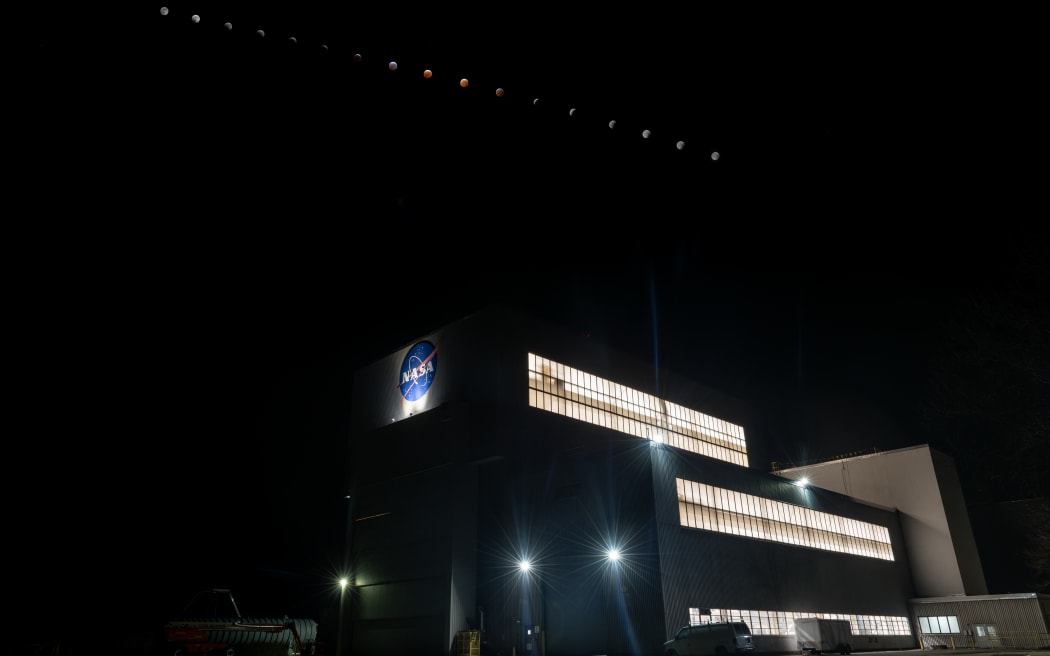 The phases of the lunar eclipse are visible in this time-lapse image of the Moon above the Space Environments Complex at NASA’s Glenn Research Center at NASA’s Neil Armstrong Test Facility in Sandusky, Ohio on 14 March, 2025.