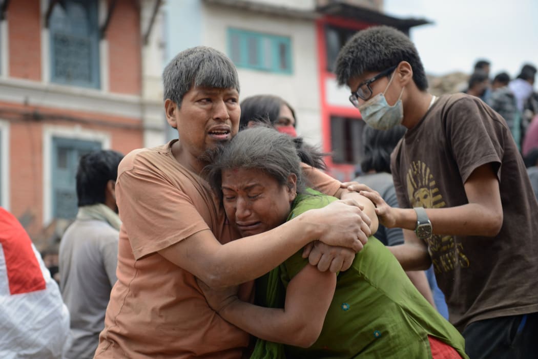 A couple hold each other in Kathmandu's Durbar Square, a UNESCO World Heritage Site.