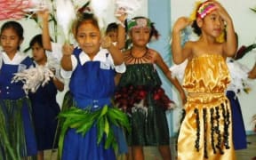 Students at a mission school in Samoa dancing.