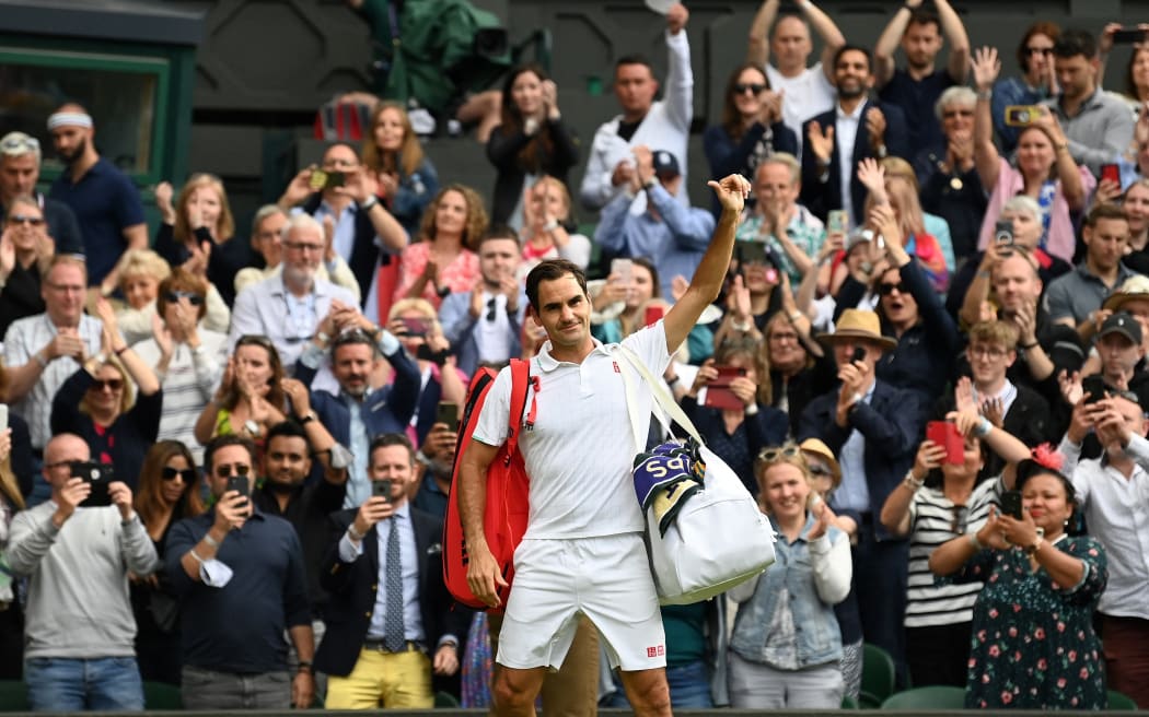 Switzerland's Roger Federer leaves the court after losing to Poland's Hubert Hurkacz during their men's quarter-finals match on the ninth day of the 2021 Wimbledon Championships at The All England Tennis Club in Wimbledon, southwest London, on July 7, 2021.