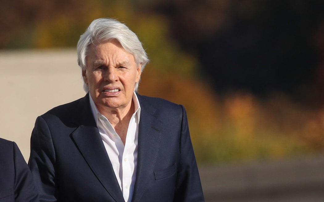 CENTRAL ISLIP, NEW YORK - OCTOBER 25: Former Abercrombie & Fitch CEO Mike Jeffries leaves a Long Island court with members of his legal team after pleading not guilty to sex-trafficking charges allegedly involving young male models on October 25, 2024 in Central Islip, New York. Jeffries, who is 80, was released on a $10 million bond and answered to 16 counts against him.   Spencer Platt/Getty Images/AFP (Photo by SPENCER PLATT / GETTY IMAGES NORTH AMERICA / Getty Images via AFP)