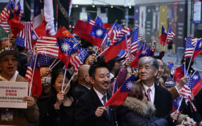 Supporters look on as Taiwan's President Tsai Ing-wen (not pictured) arrives at her hotel in New York City on 29 March, 2023.