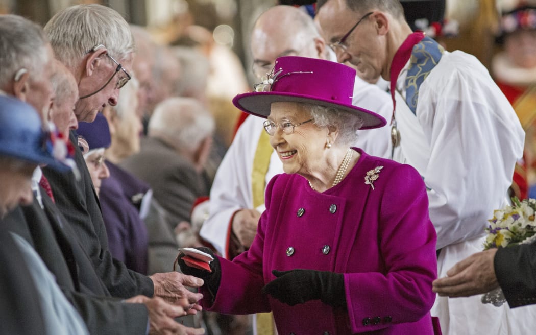 The Queen distributes Maundy money during a Royal Maundy Service at Blackburn Cathedral.