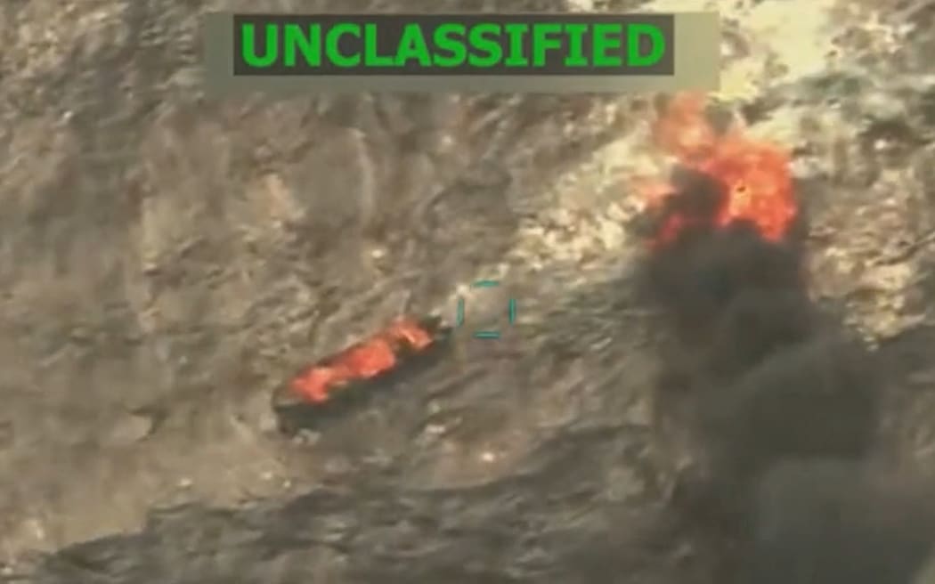 (FILES) This screen grab from a video posted by US President Donald Trump on his Truth Social account on September 15, 2025, shows what President Trump says is US Military forces conducting a strike on a boat carrying alleged drug traffickers in the Caribbean Sea in the SOUTHCOM area of responsibility on Monday, September 15, 2025. Venezuela said on September 19, 2025, it would seek a United Nations probe of US strikes that killed 14 alleged drug traffickers on at least two boats in international waters off its coast. (Photo by HANDOUT / US President Donald Trump's TRUTH Social account / AFP) / RESTRICTED TO EDITORIAL USE - MANDATORY CREDIT "AFP PHOTO /  US PRESIDENT DONALD TRUMP'S TRUTH SOCIAL ACCOUNT / HANDOUT"- HANDOUT - NO MARKETING NO ADVERTISING CAMPAIGNS - DISTRIBUTED AS A SERVICE TO CLIENTS