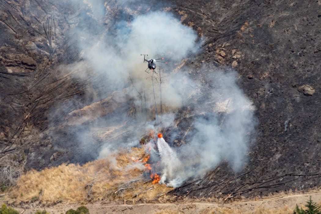 Fire crews battling the Port Hills fire in Christchurch for a second day, on 15 February, 2024.