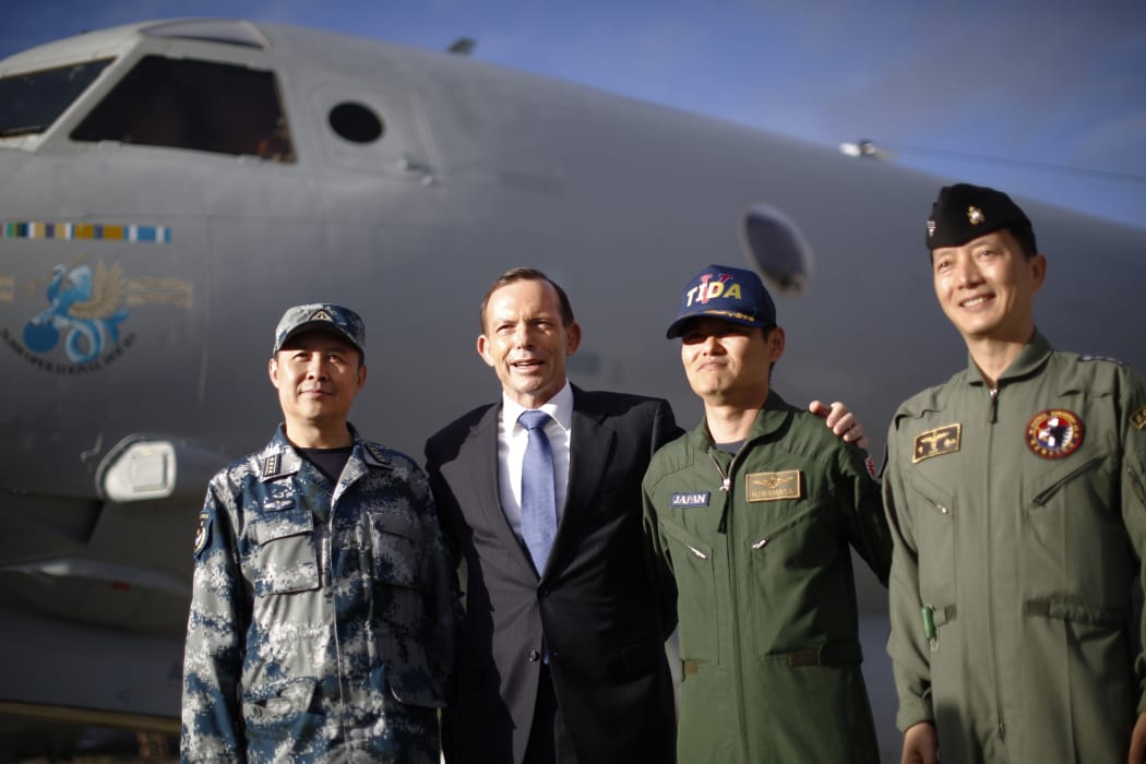 Australian Prime Minister Tony Abbott (second left) with leaders of China, Japan and South Korea's military efforts  at the RAAF base in Perth.