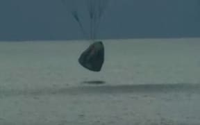 This screen grab shows SpaceX's Inspiration4 with first all-civilian crew aboard returning to Earth off the Florida coast today.