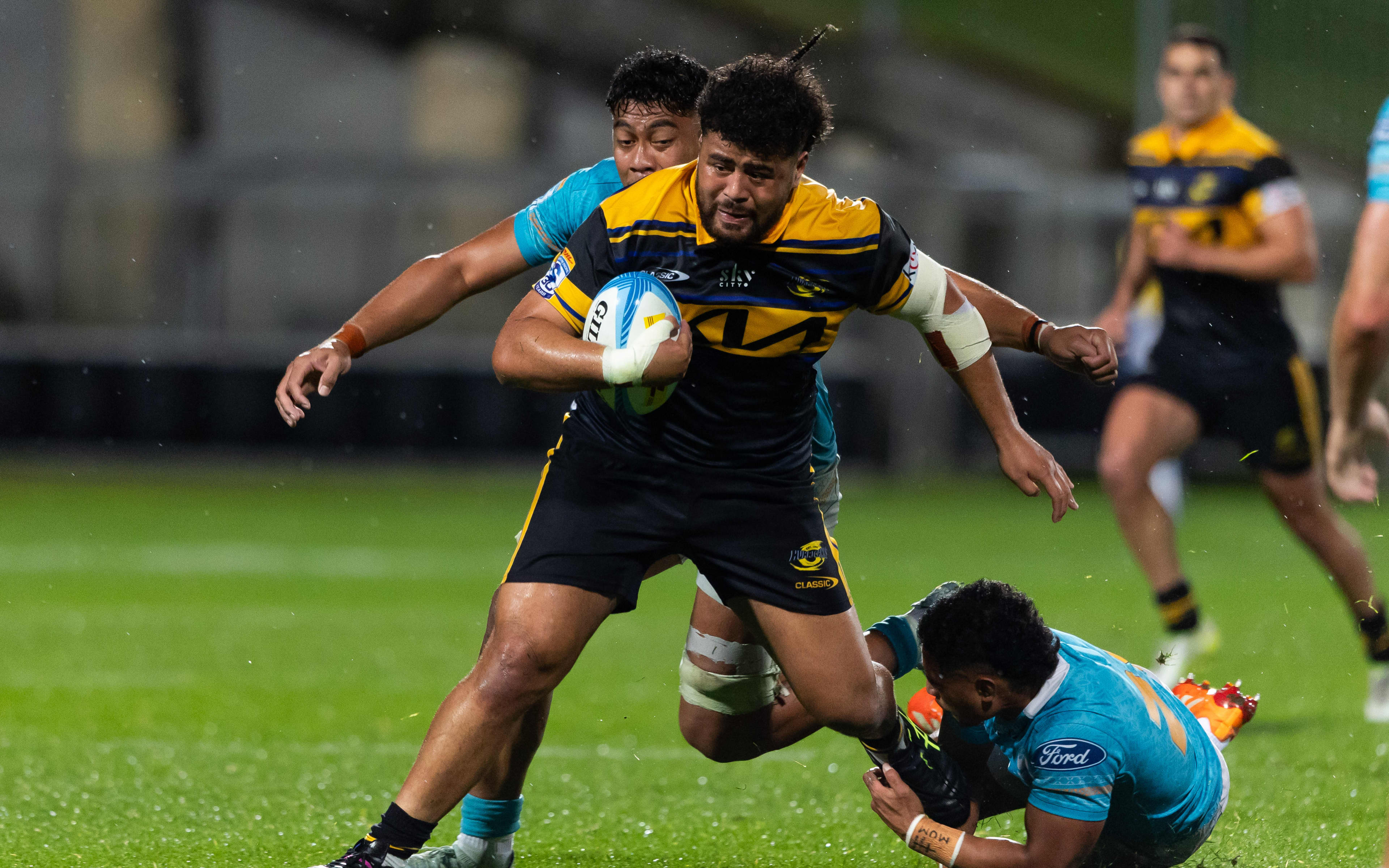 Hurricanes prop Siale Lauaki on the run against Moana Pasifika.