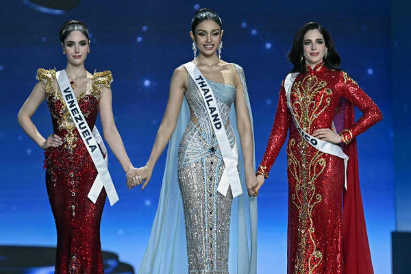 Miss Mexico Fatima Bosch (R), Miss Thailand Praveenar Singh (C) and Miss Venezuela Stephany Adriana Abasali Nasser (L) wait before the top two places are announced at the 2025 Miss Universe pageant in Nonthaburi, north of Bangkok, on November 21, 2025.