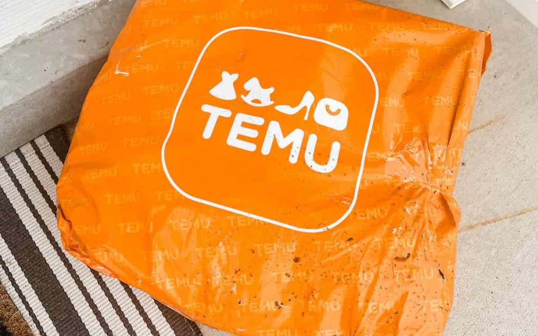 An orange bag with Temu logo