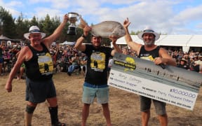 Kaitāia man Rory Collings - seen here celebrating with contest organisers Dave Collard and John Stewart - is $30,000 richer after winning the 2025 Ninety Mile Beach Snapper Bonanza. Photo: Supplied/Louise Strong