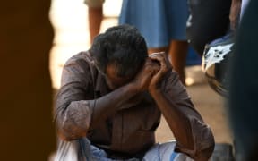 A relative of a Sri Lankan victim of an explosion at a church weeps outside a hospital in Batticaloa in eastern Sri Lanka.