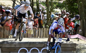 New Zealander Samuel Gaze and Czech Ondrej Cink pictured in action during the men's cross-country mountain bike cycling race at the Paris 2024 Olympic Games, at the Colline d'Elancourt climb near Paris, France on Monday 29 July 2024. The Games of the XXXIII Olympiad are taking place in Paris from 26 July to 11 August. The Belgian delegation counts 165 athletes competing in 21 sports. BELGA PHOTO DIRK WAEM (Photo by DIRK WAEM / BELGA MAG / Belga via AFP)