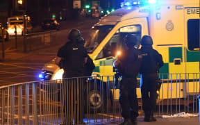 Emergency response vehicles arrive at the scene of a suspected terrorist attack during a pop concert by US star Ariana Grande in Manchester, northwest England on May 23, 2017.