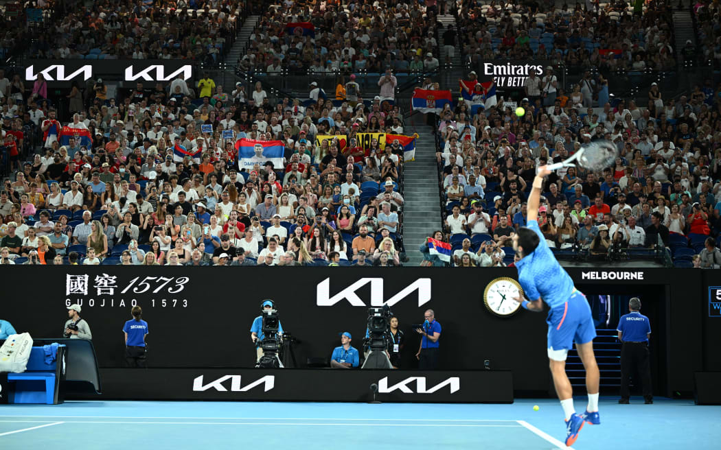 Supporters watch Novak Djokovic of Serbia at the Australian open.