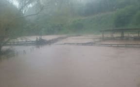 Fences on Neil Heather's farm were broken and flooded after the Ngongotaha Stream breached its banks.