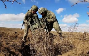 Russian armed forces artillery units conduct combat exercises in the Opuk training area in annexed Crimea in this footage released by the Russian defense ministry on Monday Feb 14, 2022.