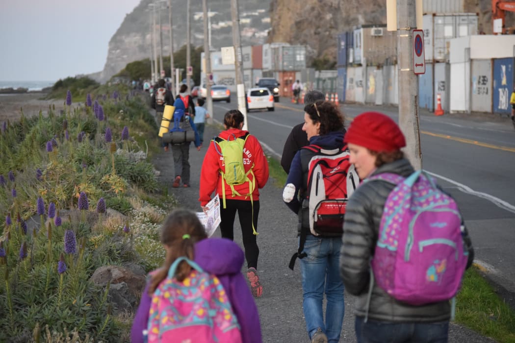 A photo of the pupils and their parents coming down the home stretch as they head into Sumner, alongside the beach