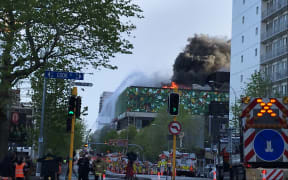 Flames and smoke were still coming from the roof of the convention centre building on Wednesday morning.