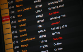 Cancelled flights are displayed on a departures board at Stansted Airport, north of London, on August 29, 2023 after UK flights were delayed over a technical issue. Flights to and from the UK were experiencing disruptions after Britain's air traffic control systems were temporarily hit by a technical fault. The National Air Traffic Services (NATS) said it had "identified and remedied" a technical issue which forced it to impose traffic flow restrictions. (Photo by Daniel LEAL / AFP)