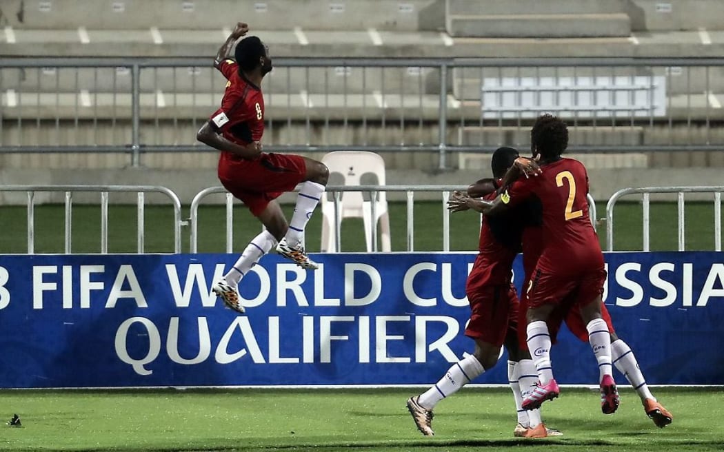 PNG striker Nigel Dabinyaba (L) celebrates a goal during the OFC Nations Cup.