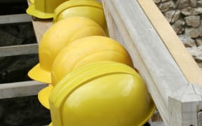 A row of mine workers' hard hats