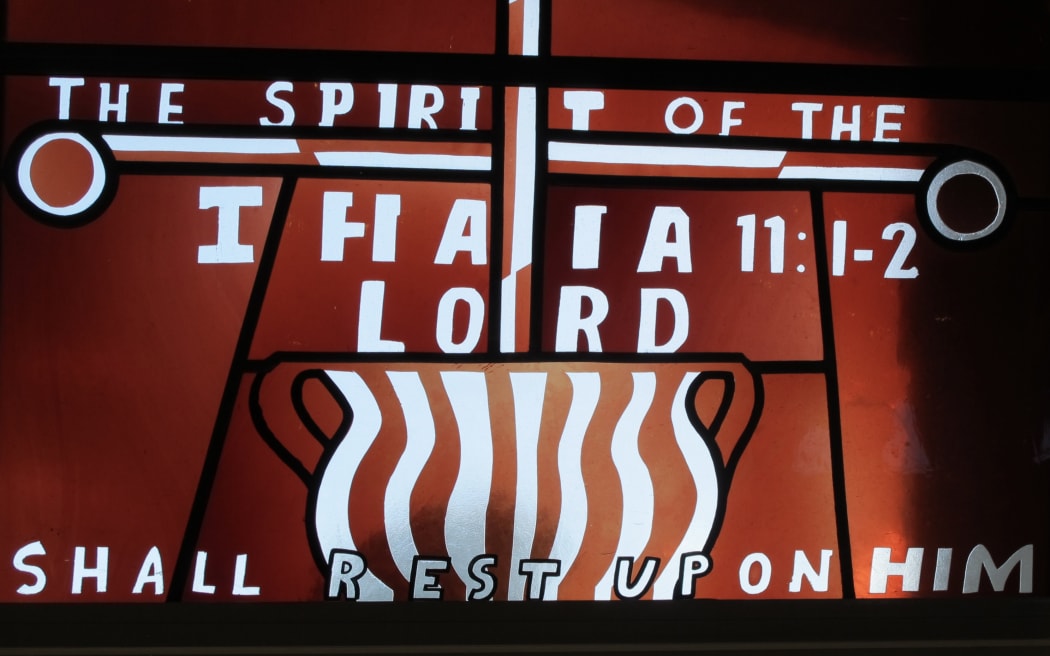 Text from Isaiah in stained glass form