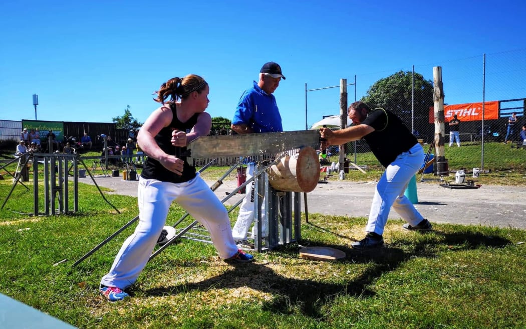 Emma Shaw competing in the Jack and Jill sawing with her partner Reuben Carter.