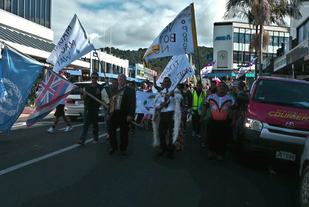 Protestors march through Whangarei to voice their disagreement with plans to allow Zodiac Holdings to build a water bottling factory at Porotī Springs.