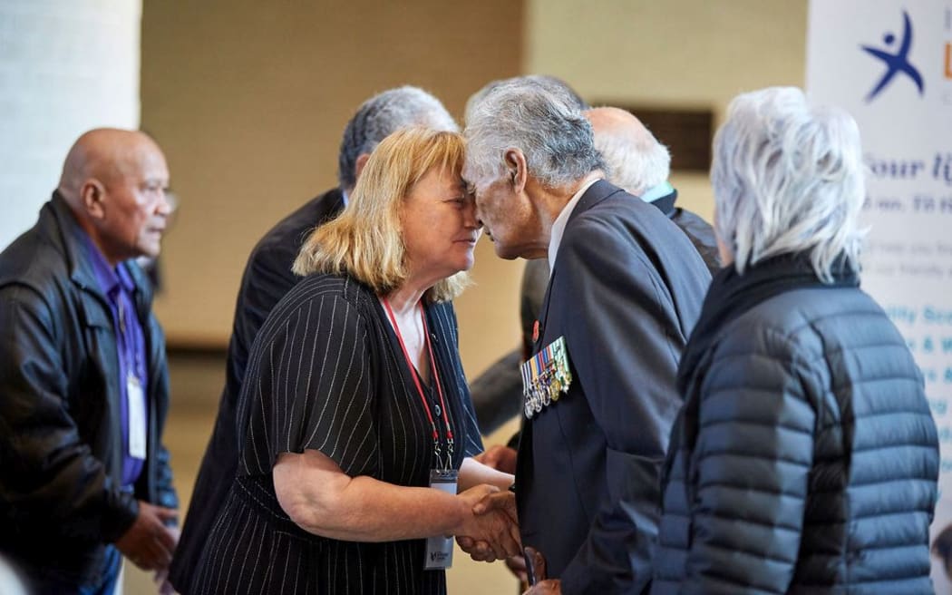 Head of Veterans' Affairs Bernadine Mackenzie shares a hongi with veteran Bunny Tumai.