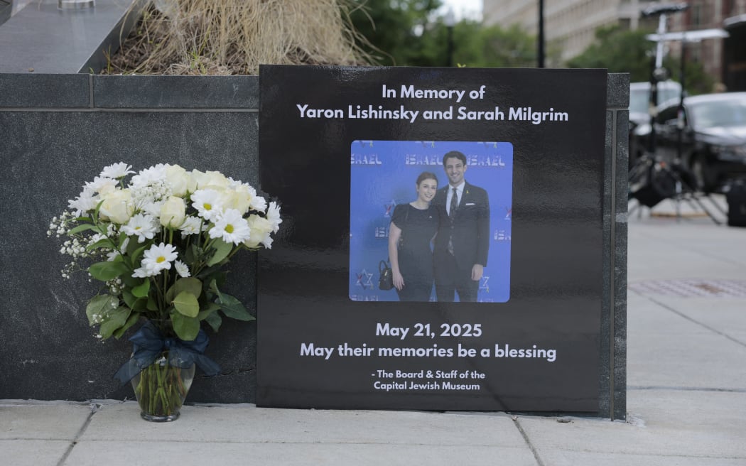 WASHINGTON, DC - MAY 23: A tribute and flowers for Israeli Embassy staff members Yaron Lischinsky and Sarah Lynn Milgrim are seen outside the Lillian and Albert Small Capital Jewish Museum on May 23, 2025 in Washington, DC. A suspect, identified as Elias Rodriguez, has been arrested and charged with first-degree murder and other crimes for the killing the two Israeli Embassy staff members outside of the Capital Jewish Museum.   Anna Moneymaker/Getty Images/AFP (Photo by Anna Moneymaker / GETTY IMAGES NORTH AMERICA / Getty Images via AFP)