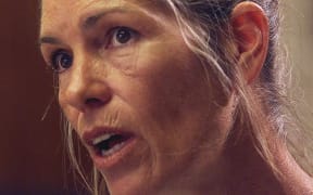 Leslie Van Houten expresses remorse in the killings of the LaBianca couple to members of the Board of Prison Terms commissioners during her parole hearing 28 June 2002.