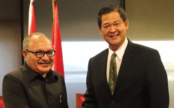 PNG prime minister Peter O'Neill greets the new Indonesian ambassador Andriana Sutandy in Port Moresby.