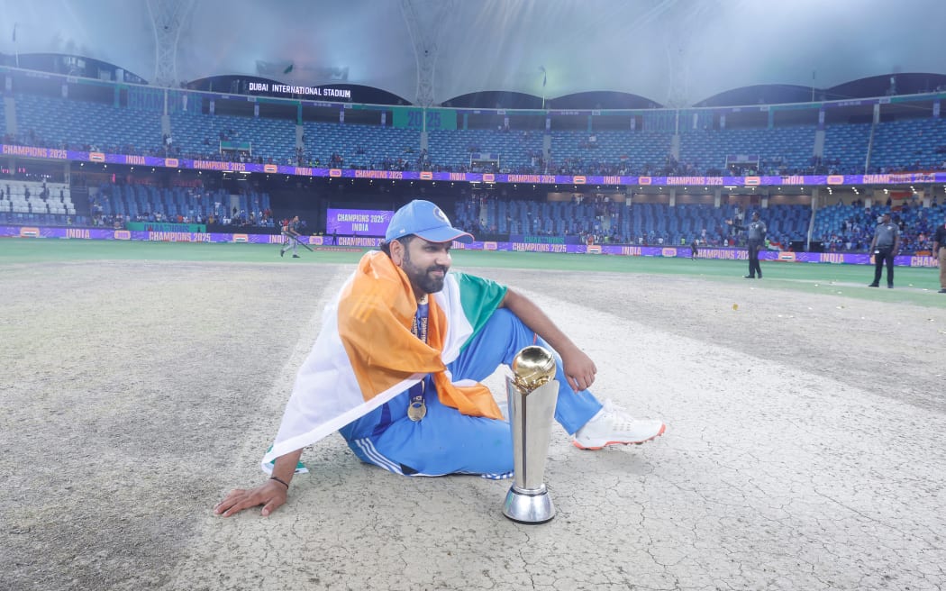 Rohit Sharma captain of India celebrates with series trophy after the win over New Zealand in the Champions Trophy final, 2025.