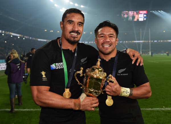 All Blacks Jerome Kaino and Keven Mealamu holding the Webb Ellis trophy after winning the Rugby World Cup final against Australia's Wallabies at Twickenham Stadium, London, England on 31 October, 2015.