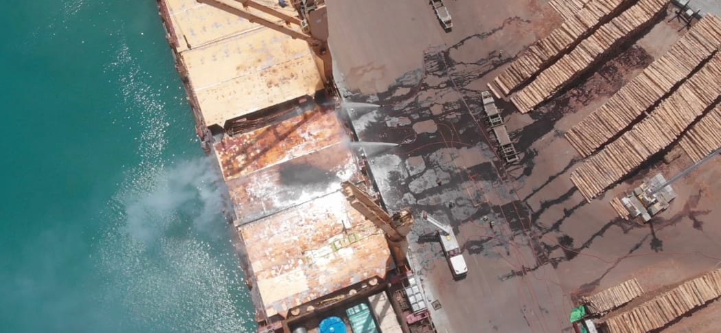Firefighters battle a blaze on a container ship at Napier Port, on 18 December, 2020.