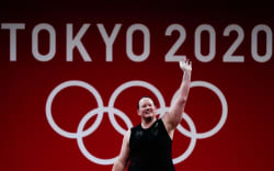 New Zealand’s Laurel Hubbard waves during the women’s +87kg weightlifting Group B competition at the Tokyo 2020 Olympic Games.