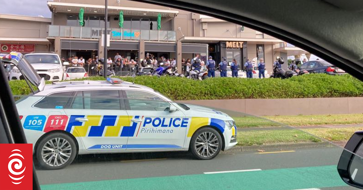 Gang members throw objects at police, do burnout outside Auckland bar