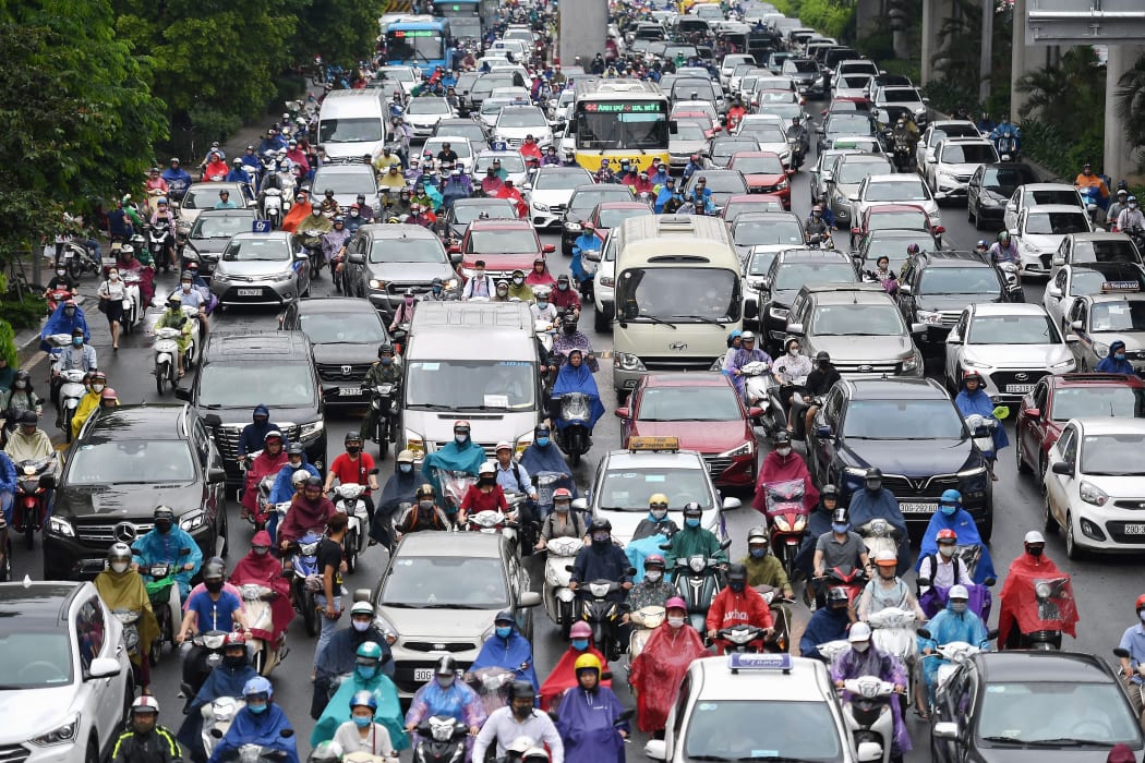 Motorists in morning rush hour traffic in Hanoi on 12 May.